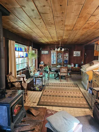 a living room with furniture a dining table and chairs with outer view
