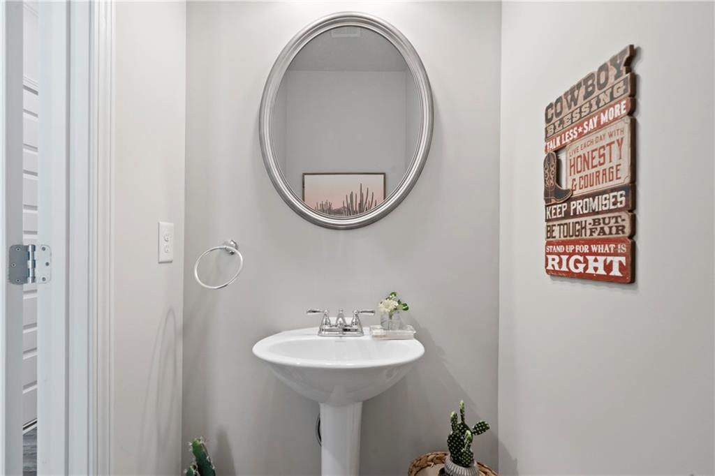 103 Waterside Drive Calhoun, GA 30701 - Photo 11 of 48 a bathroom with a sink and a mirror
