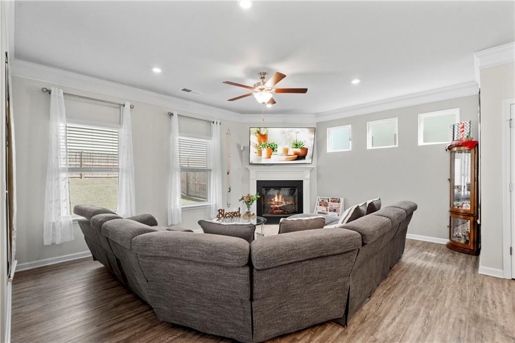 103 Waterside Drive Calhoun, GA 30701 - Photo 17 of 48 a living room with furniture a fireplace and a flat screen tv