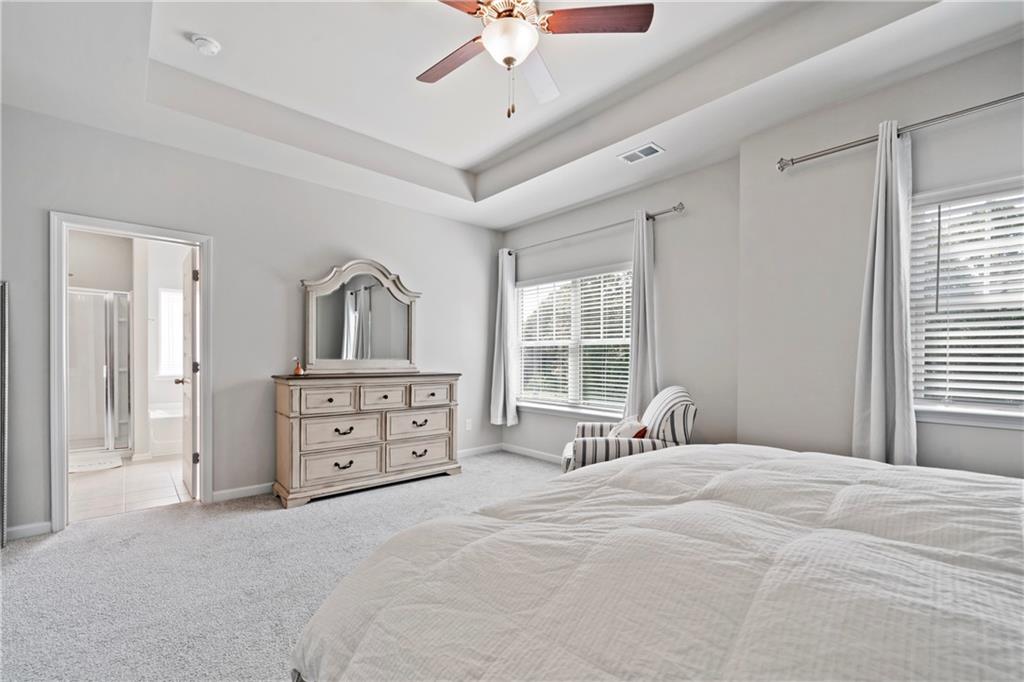 103 Waterside Drive Calhoun, GA 30701 - Photo 24 of 48 a bedroom with a bed a dresser and a window