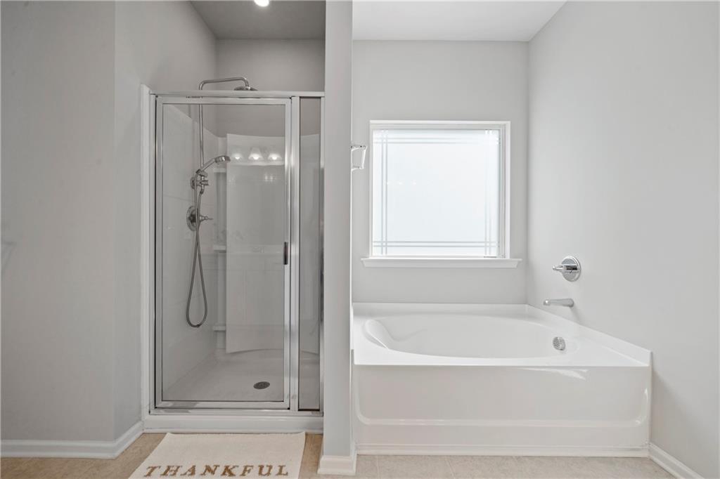 103 Waterside Drive Calhoun, GA 30701 - Photo 26 of 48 a white bath tub sitting next to a shower