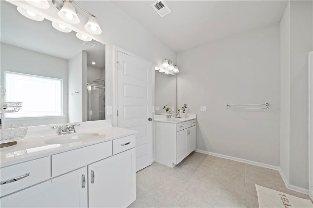 103 Waterside Drive Calhoun, GA 30701 - Photo 28 of 48 a bathroom with a sink vanity and a mirror