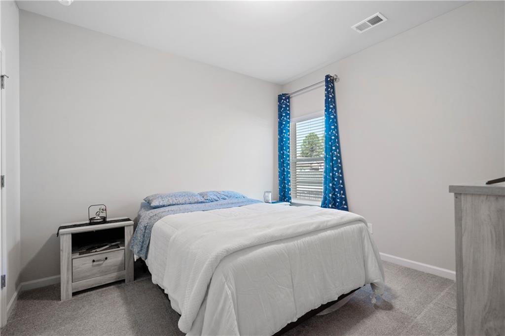 103 Waterside Drive Calhoun, GA 30701 - Photo 31 of 48 a bedroom with a bed and a window