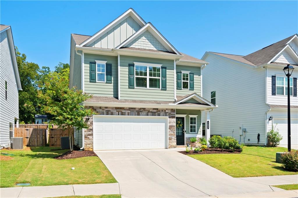103 Waterside Drive Calhoun, GA 30701 - Photo 38 of 48 a front view of a house with yard and green space