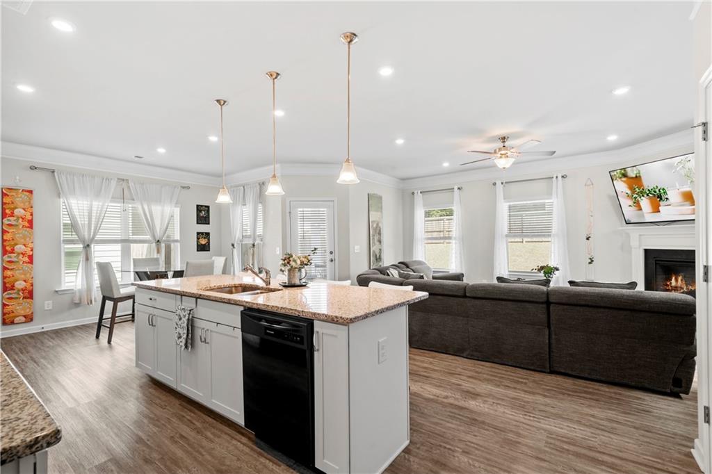 103 Waterside Drive Calhoun, GA 30701 - Photo 4 of 48 a large kitchen with lots of counter space a sink appliances and living room view