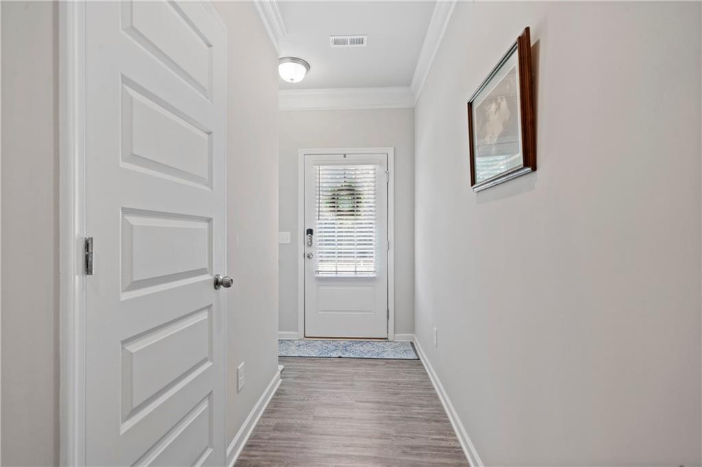 103 Waterside Drive Calhoun, GA 30701 - Photo 10 of 48 a view of a hallway with wooden floor and entryway