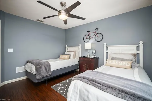 a bedroom with double bed and a large window