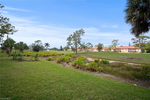 a view of a golf course with a garden