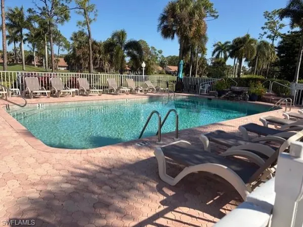 a view of a swimming pool with a patio
