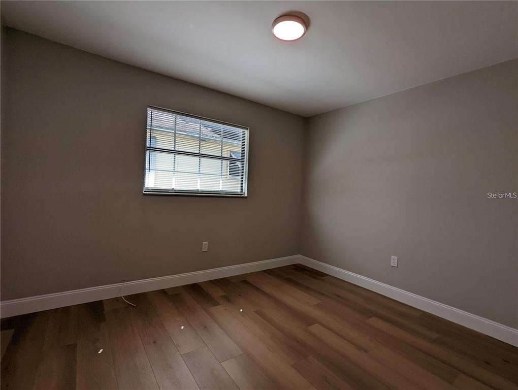 1922 Springtime Avenue Clearwater, FL 33755 - Photo 17 of 27 an empty room with a window