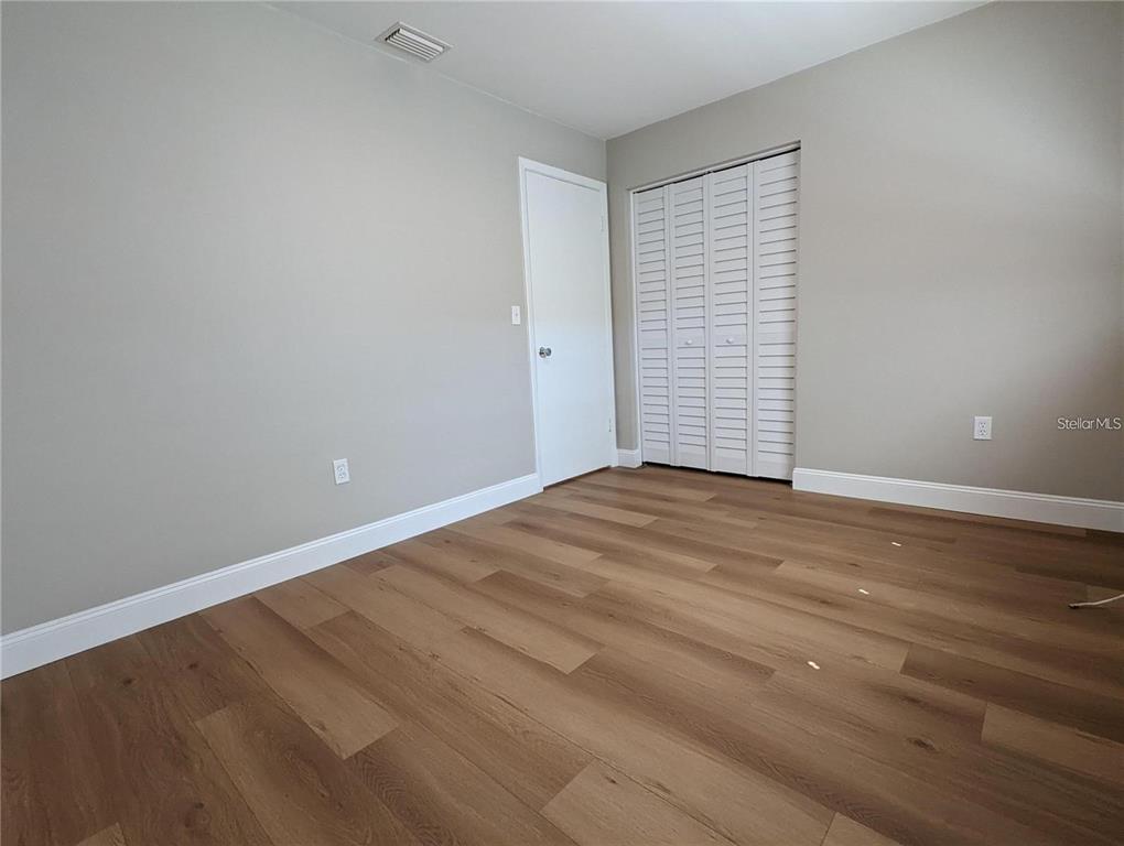 1922 Springtime Avenue Clearwater, FL 33755 - Photo 18 of 27 a view of empty room with wooden floor
