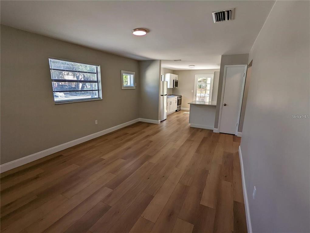 1922 Springtime Avenue Clearwater, FL 33755 - Photo 5 of 27 a view of a big room with wooden floor and windows