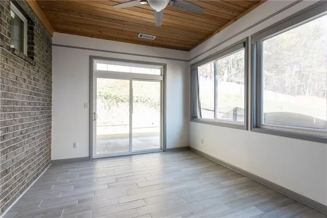 a view of an empty room with a window