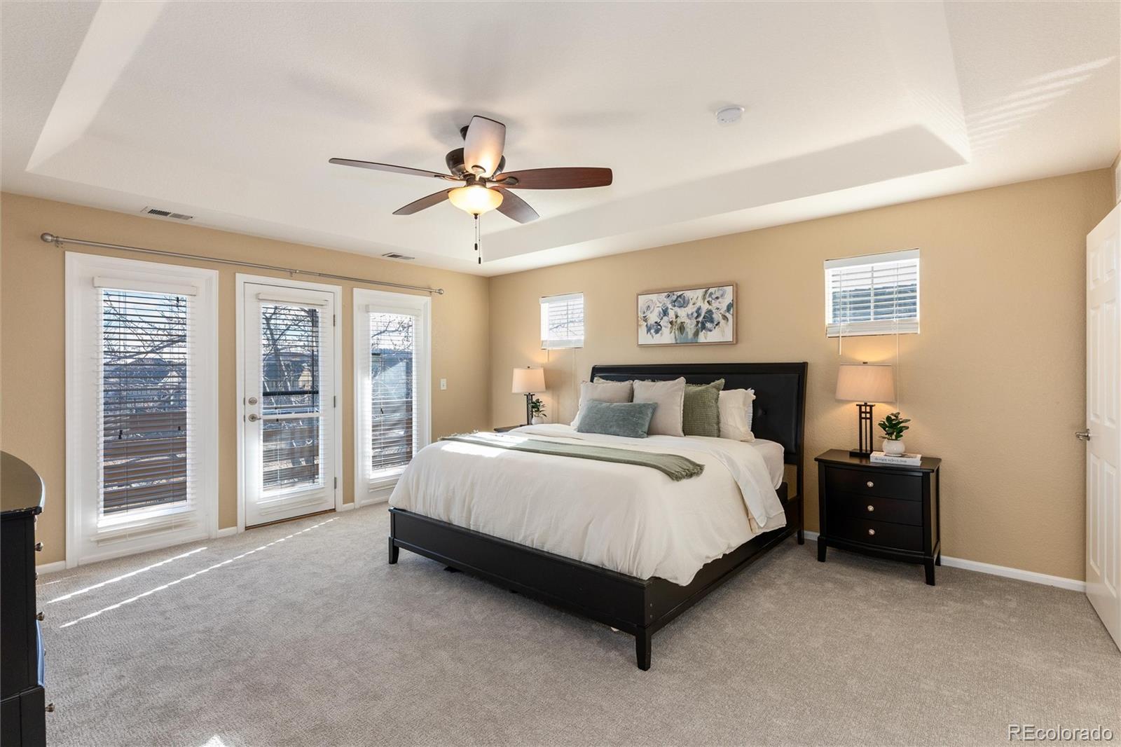 10820 Montvale Circle Highlands Ranch, CO 80130 - Photo 20 of 50 a spacious bedroom with a bed and a large window