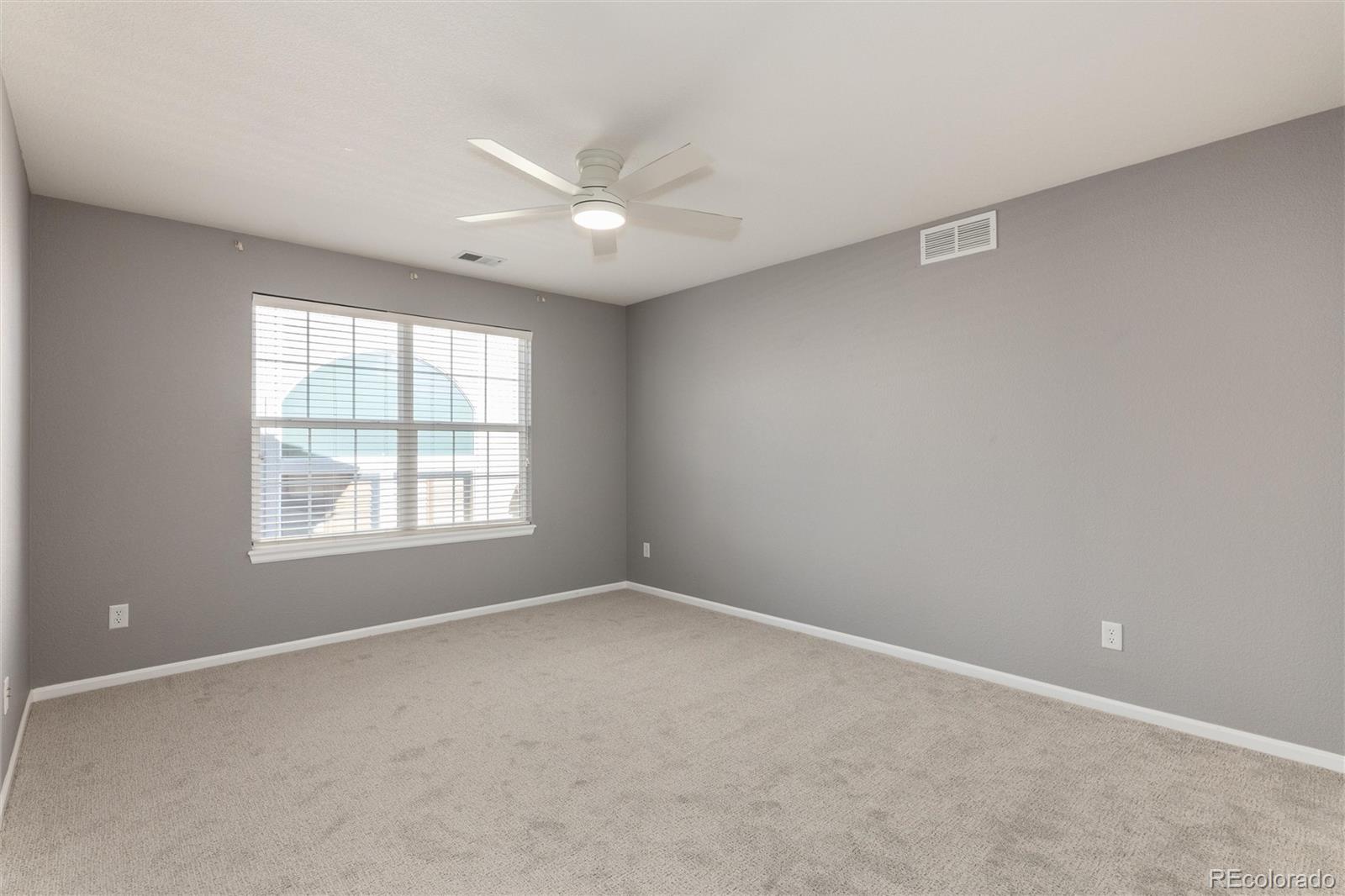 10820 Montvale Circle Highlands Ranch, CO 80130 - Photo 30 of 50 an empty room with a window and a fan