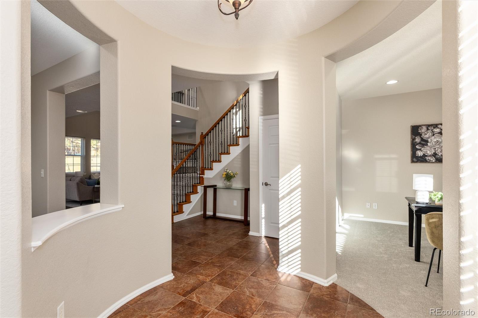 10820 Montvale Circle Highlands Ranch, CO 80130 - Photo 3 of 50 a view of entryway and hall with wooden floor