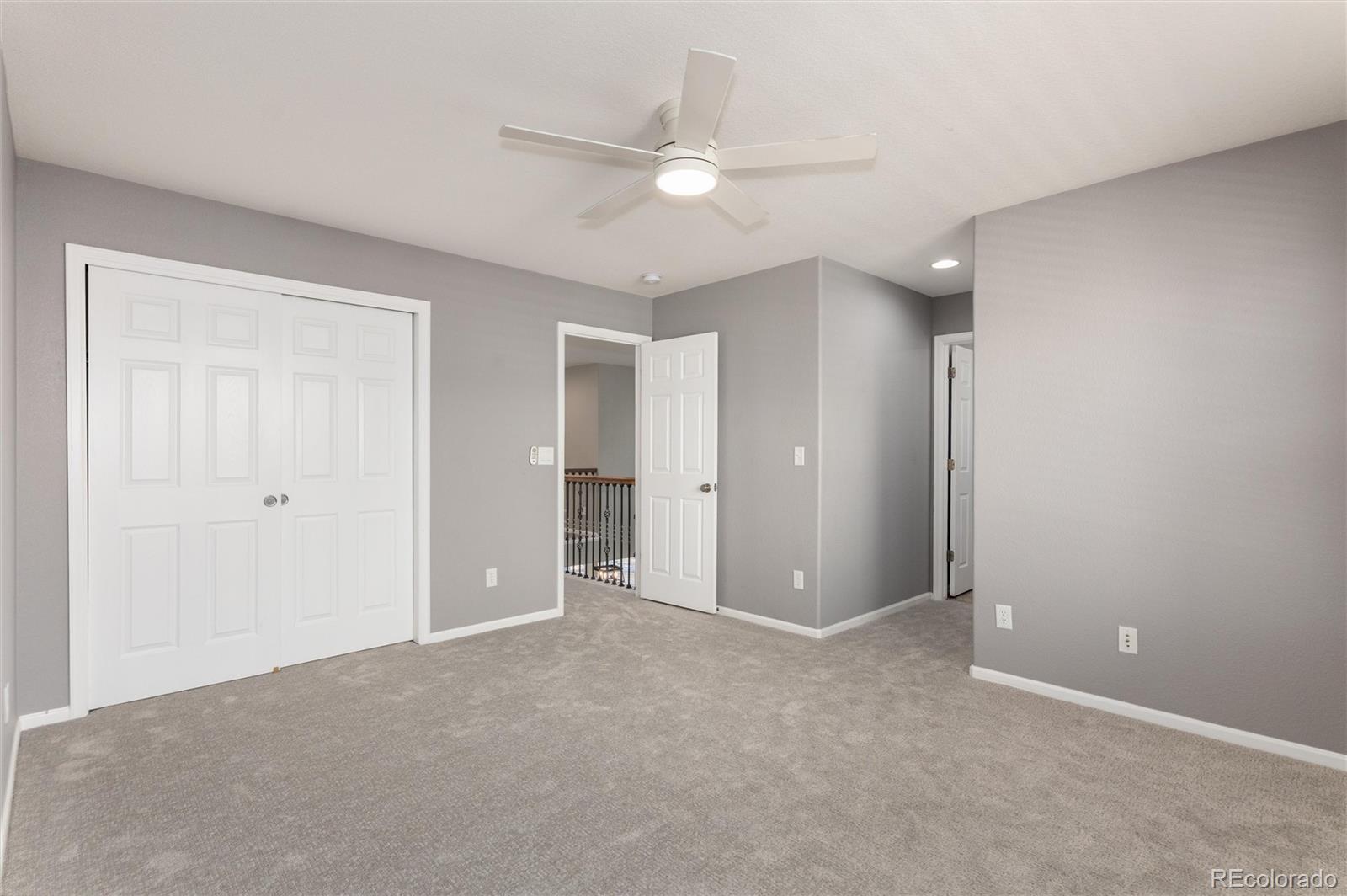 10820 Montvale Circle Highlands Ranch, CO 80130 - Photo 31 of 50 a view of an empty room and a ceiling fan