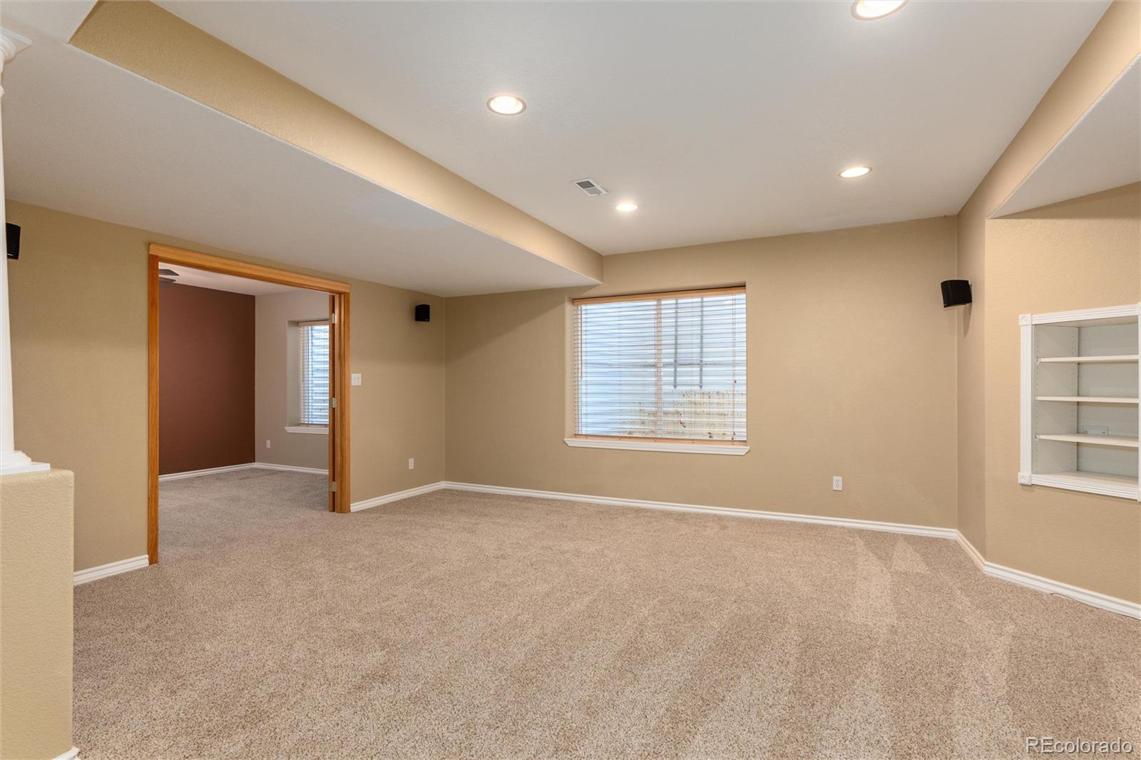 10820 Montvale Circle Highlands Ranch, CO 80130 - Photo 37 of 50 an empty room with windows and closet