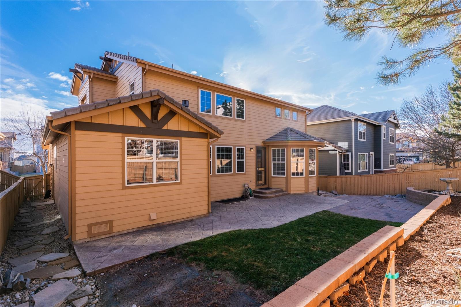 10820 Montvale Circle Highlands Ranch, CO 80130 - Photo 45 of 50 a front view of a house with a yard