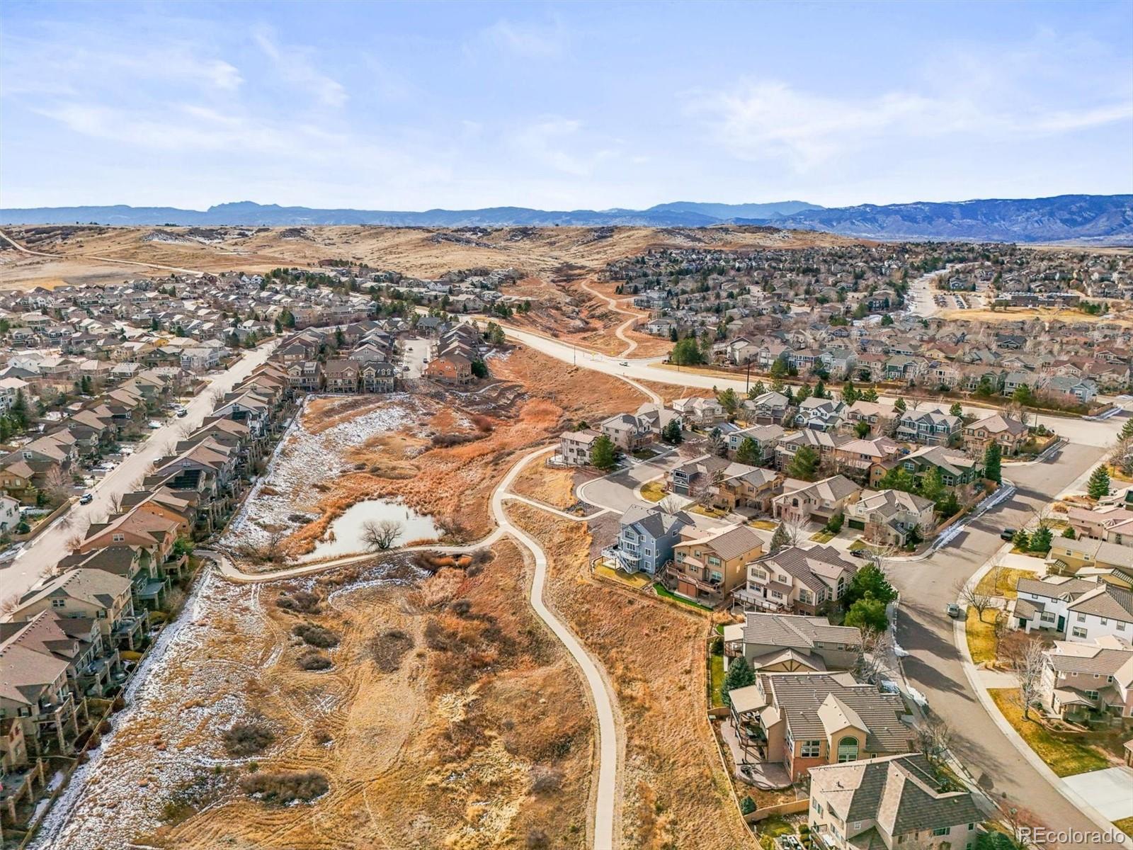 10820 Montvale Circle Highlands Ranch, CO 80130 - Photo 48 of 50 an aerial view of residential building and mountain view in back