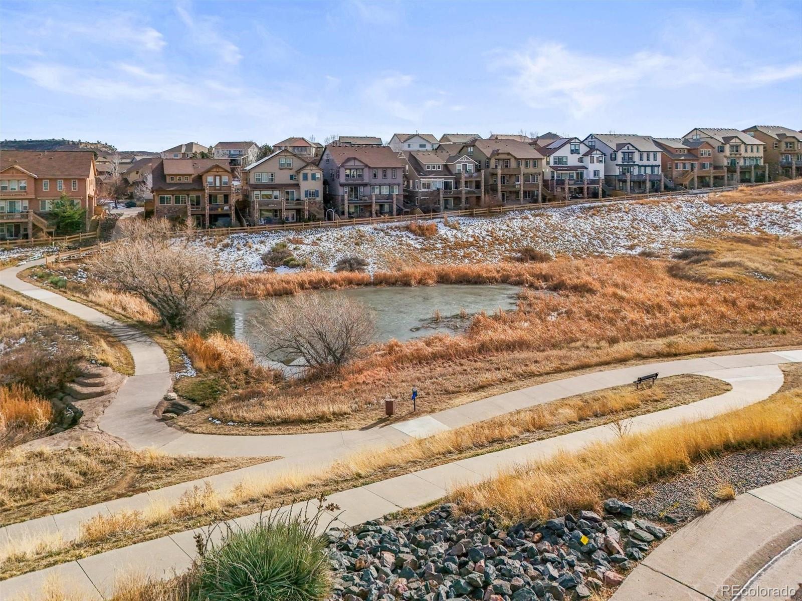 10820 Montvale Circle Highlands Ranch, CO 80130 - Photo 49 of 50 a view of a lake with mountains in the background