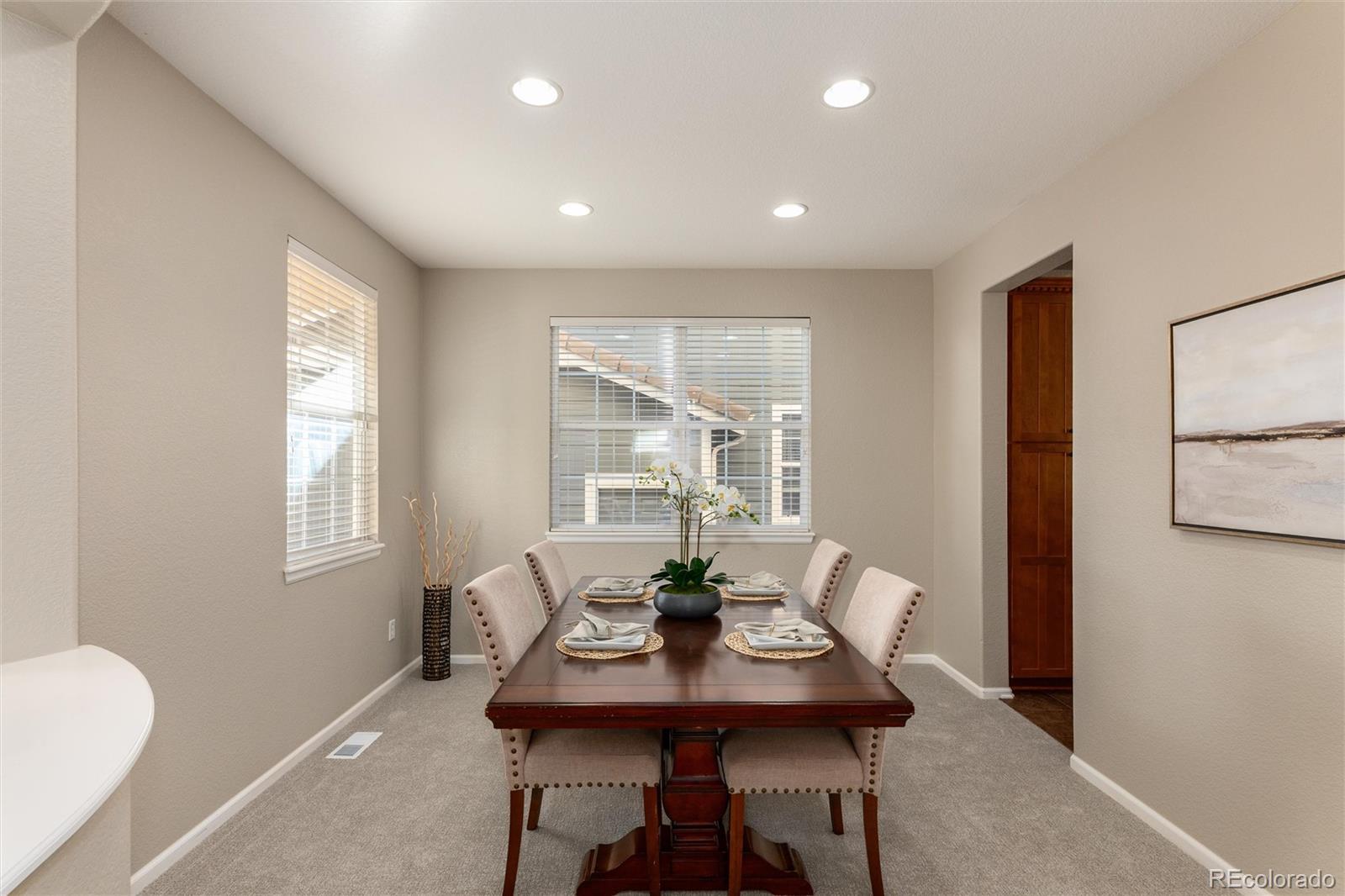 10820 Montvale Circle Highlands Ranch, CO 80130 - Photo 6 of 50 a dining room with furniture and window