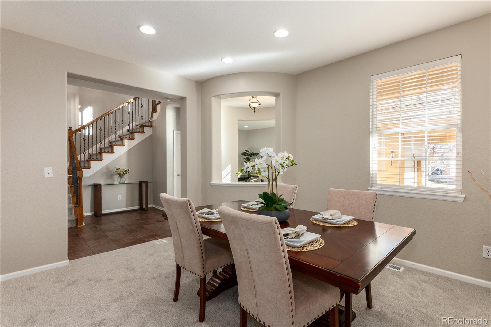 10820 Montvale Circle Highlands Ranch, CO 80130 - Photo 7 of 50 a dining room with furniture and window