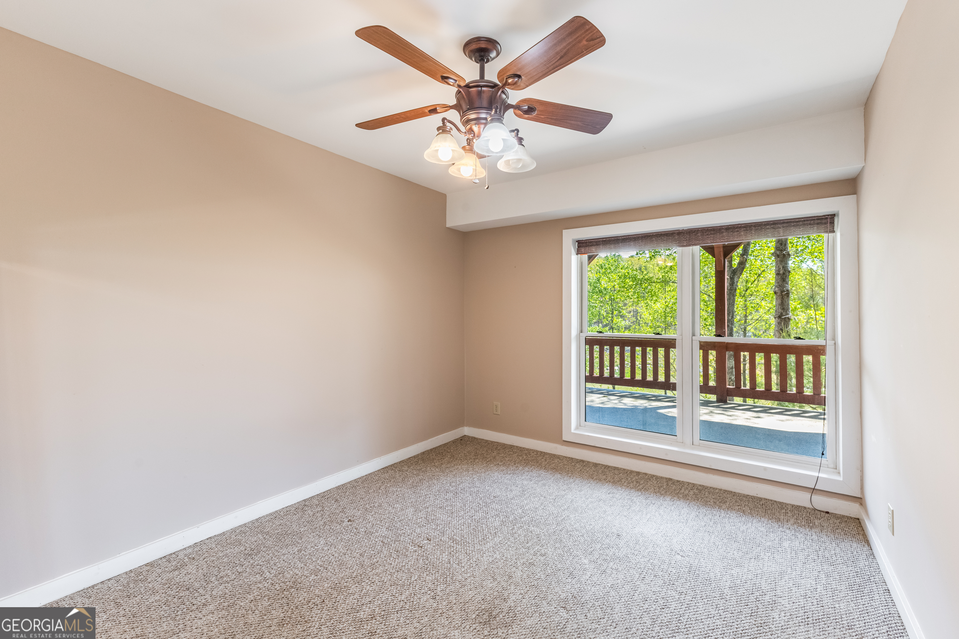 159 Eagle Creek Trail Rising Fawn, GA 30738 - Photo 28 of 37 an empty room with chandelier fan and windows