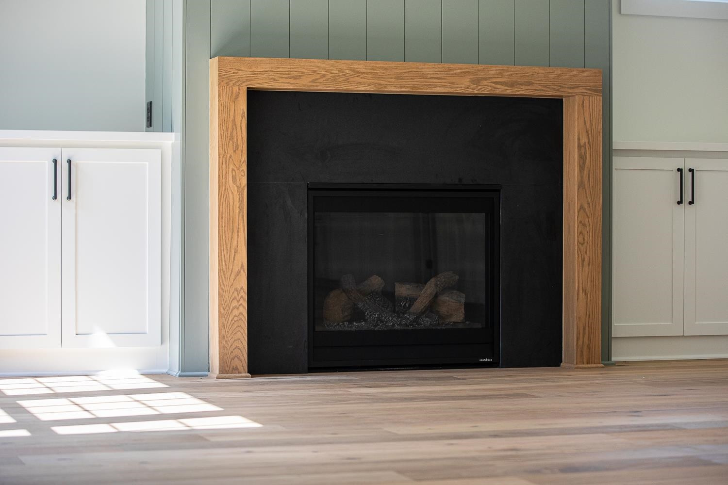 1417 Starry Night Court Raleigh, NC 27613 - Photo 11 of 44 a fireplace with a wooden floor