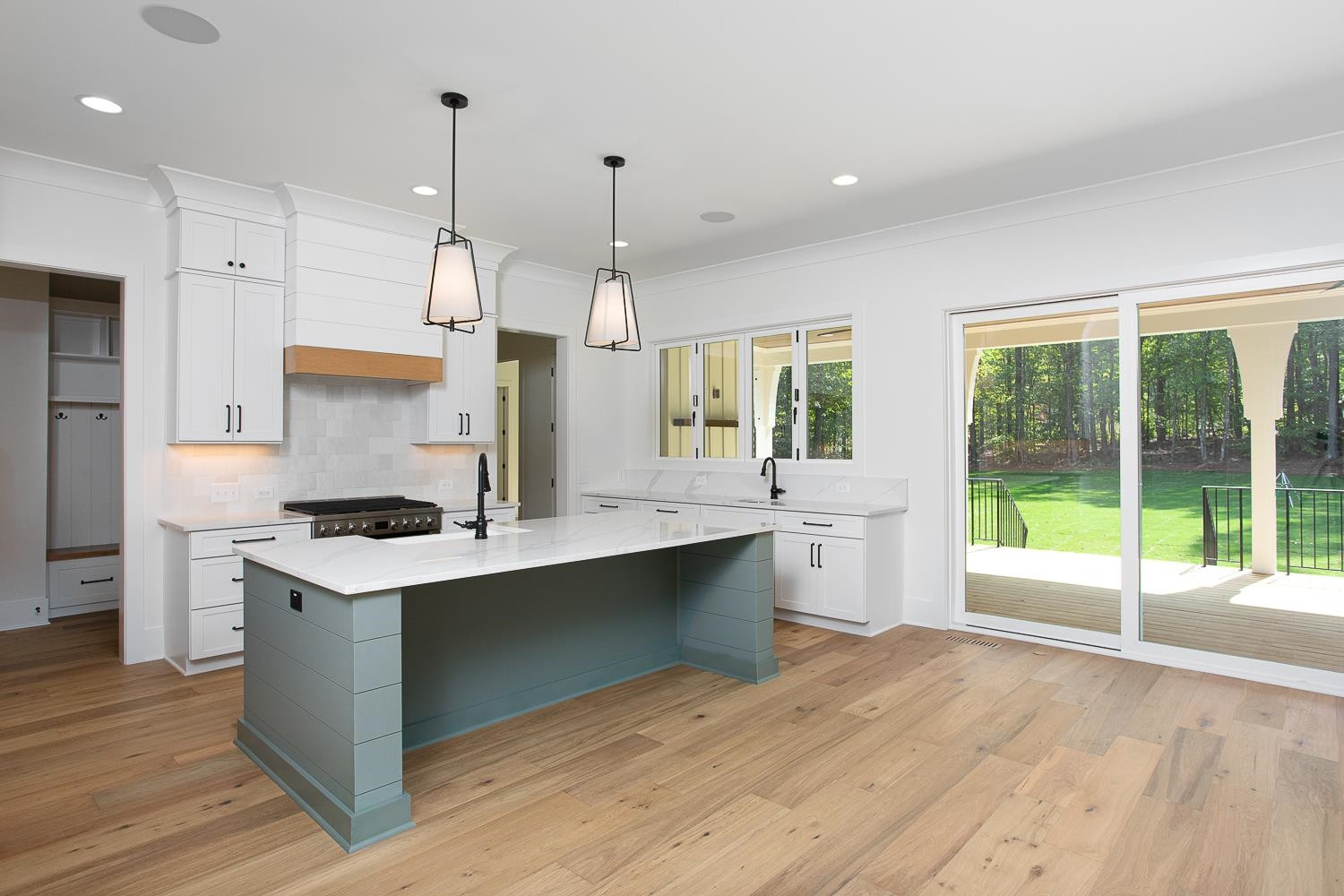 1417 Starry Night Court Raleigh, NC 27613 - Photo 14 of 44 a large kitchen with kitchen island a large island in it