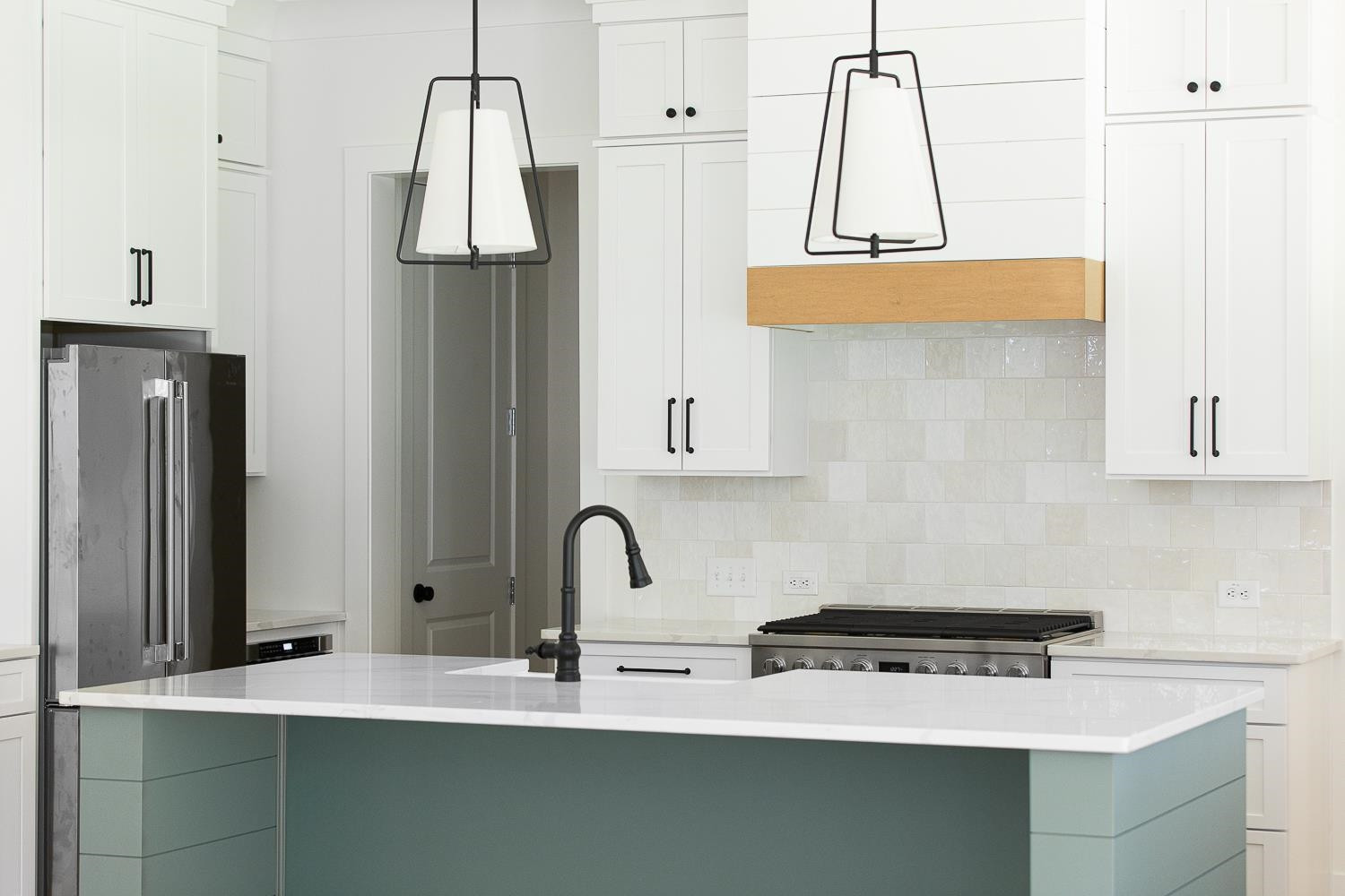 1417 Starry Night Court Raleigh, NC 27613 - Photo 16 of 44 a kitchen with a sink a refrigerator and cabinets