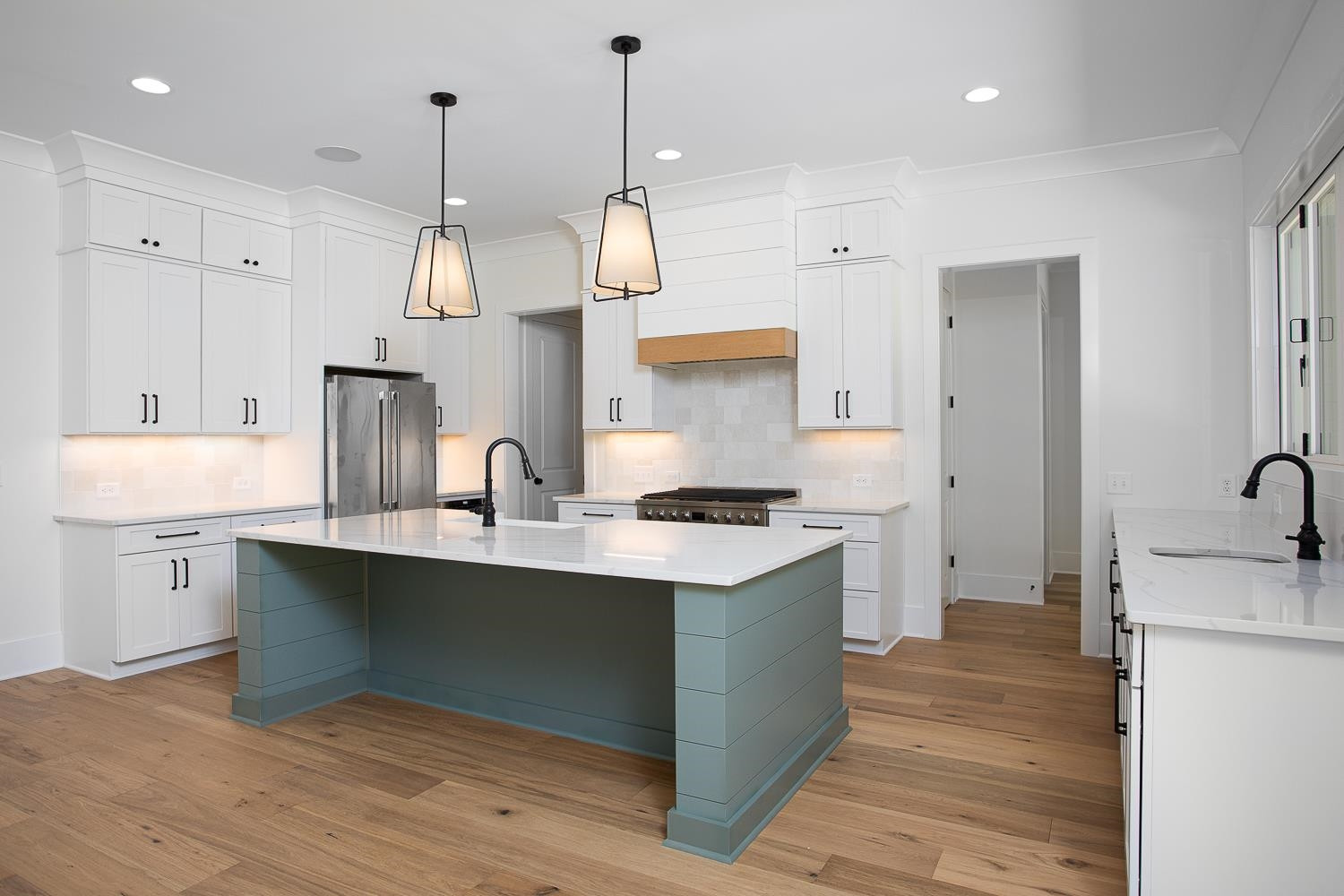 1417 Starry Night Court Raleigh, NC 27613 - Photo 18 of 44 a kitchen with stainless steel appliances granite countertop a sink a stove and a wooden floors