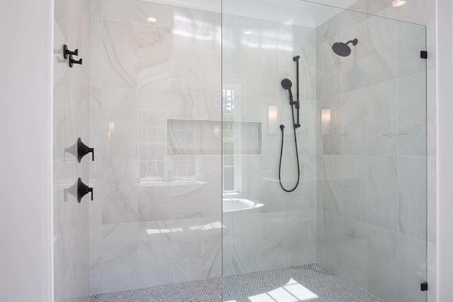 1417 Starry Night Court Raleigh, NC 27613 - Photo 32 of 44 a bathroom with a glass shower door
