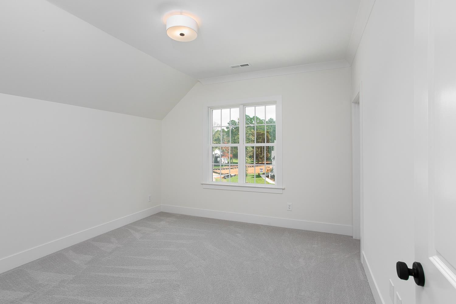 1417 Starry Night Court Raleigh, NC 27613 - Photo 37 of 44 an empty room with a window