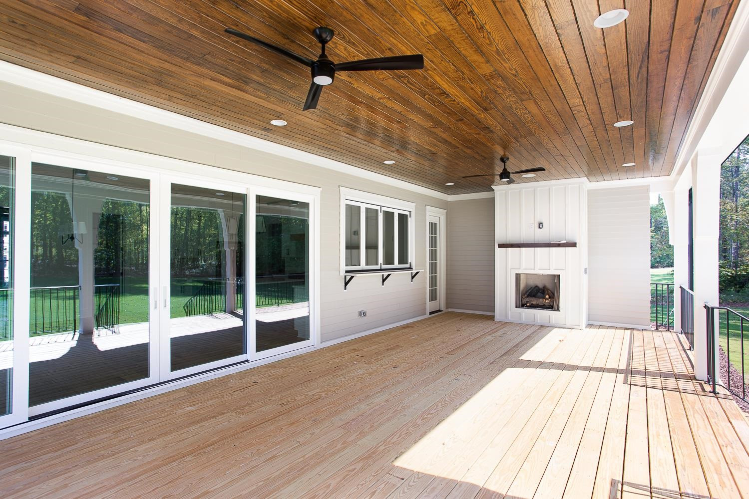 1417 Starry Night Court Raleigh, NC 27613 - Photo 40 of 44 a view of a porch with wooden floor and a fireplace