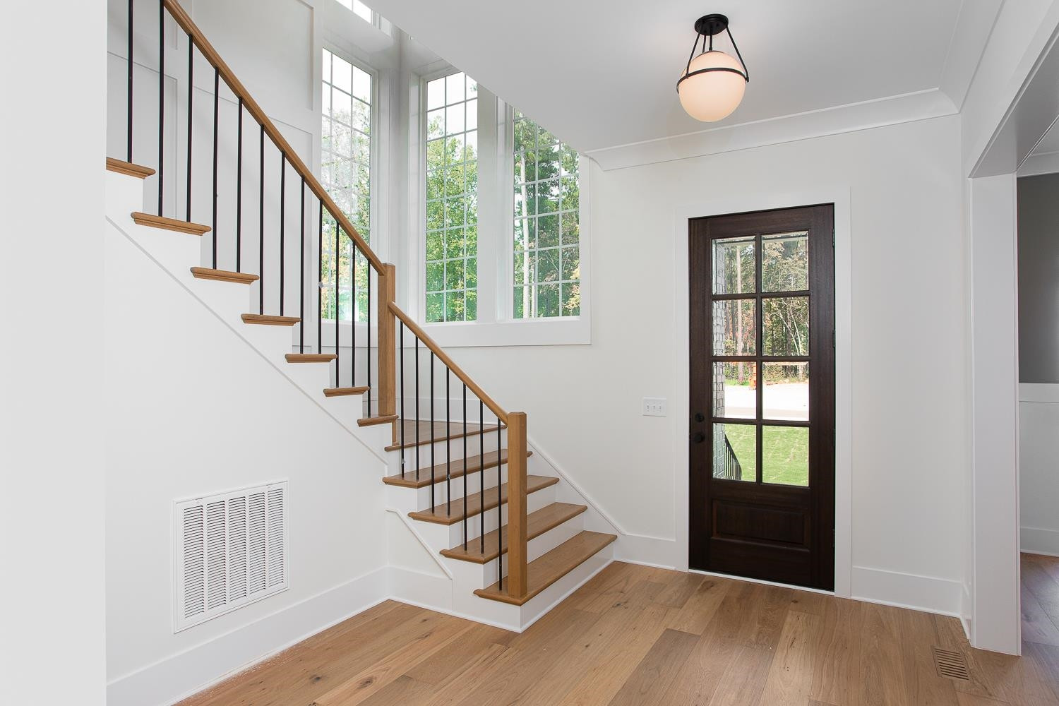 1417 Starry Night Court Raleigh, NC 27613 - Photo 5 of 44 a view of entryway and hall with wooden floor