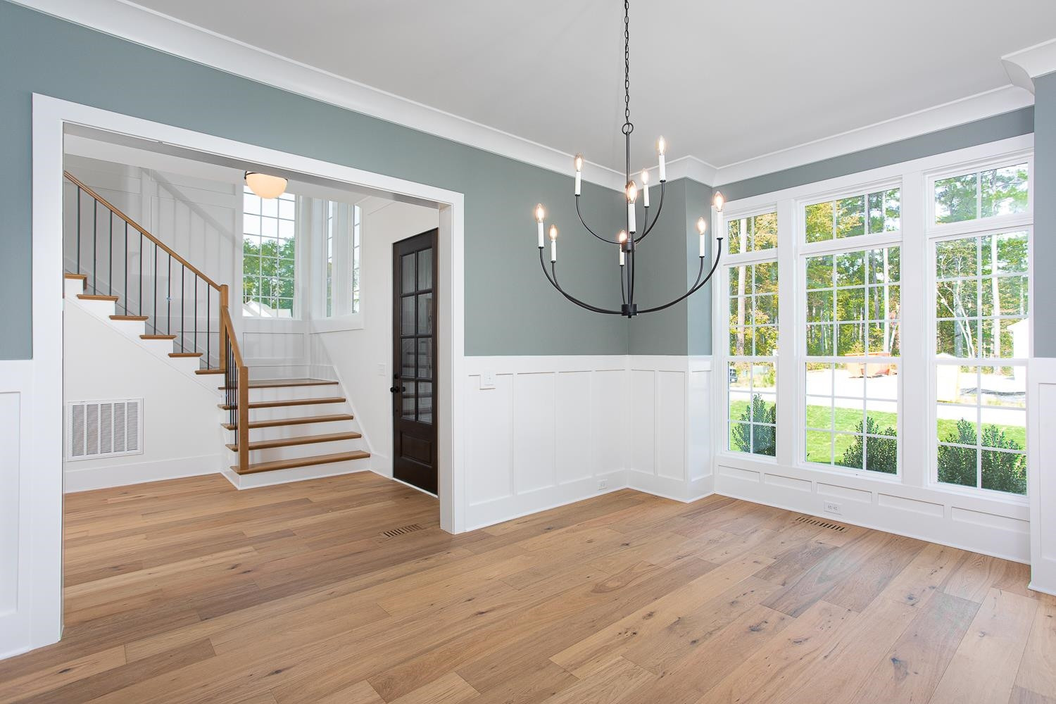 1417 Starry Night Court Raleigh, NC 27613 - Photo 8 of 44 a view of a room with wooden floor fireplace and windows