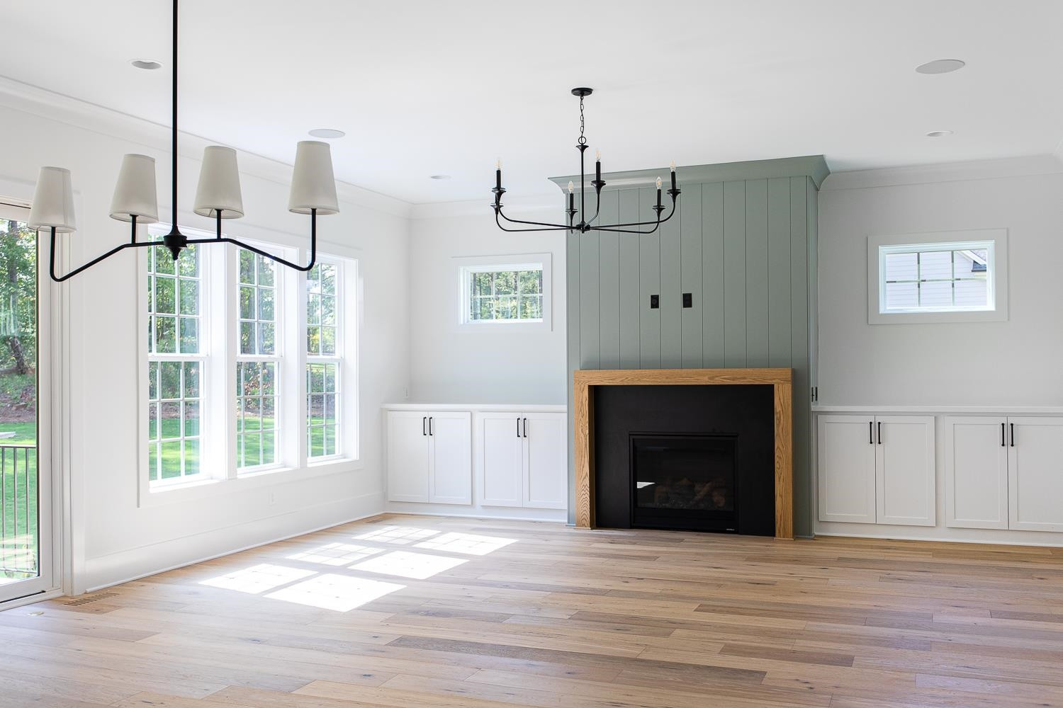 1417 Starry Night Court Raleigh, NC 27613 - Photo 10 of 44 a view of an empty room with a fireplace and a window