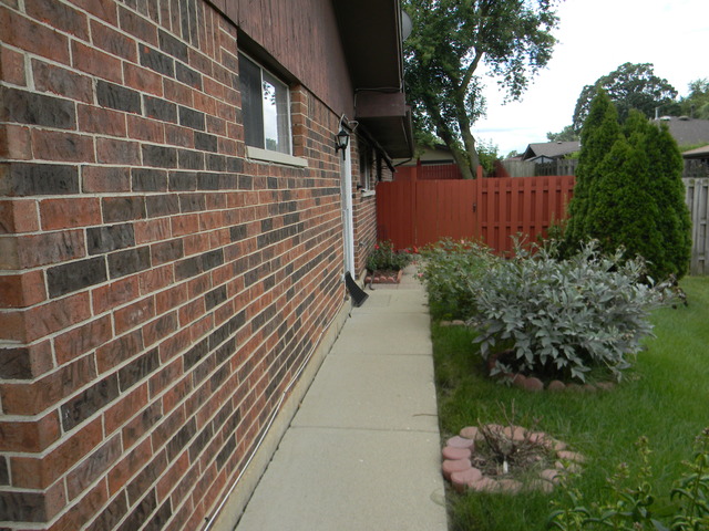 129 Virginia Court Streamwood, IL 60107 - Photo 14 of 14 a view of a pathway with a garden