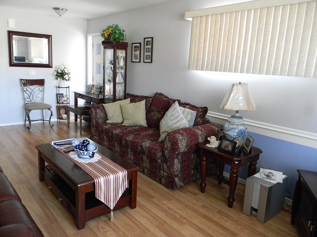 129 Virginia Court Streamwood, IL 60107 - Photo 3 of 14 a living room with furniture and wooden floor