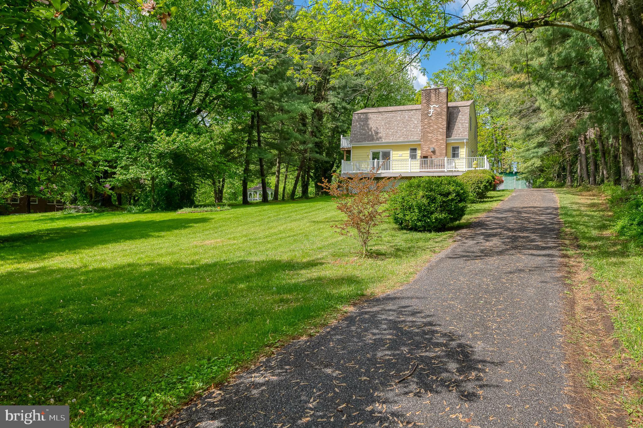 710 Magnolia Road Joppa, MD 21085 - Photo 39 of 58 a front view of a house with a yard and trees