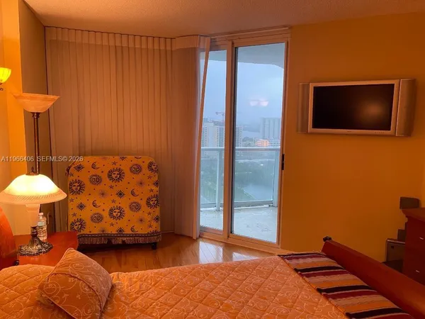 a bedroom with a bed and lamp