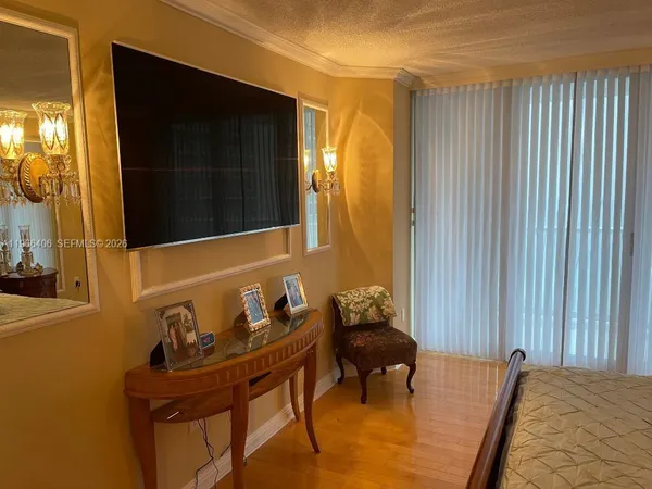 a bedroom with a bed and dresser
