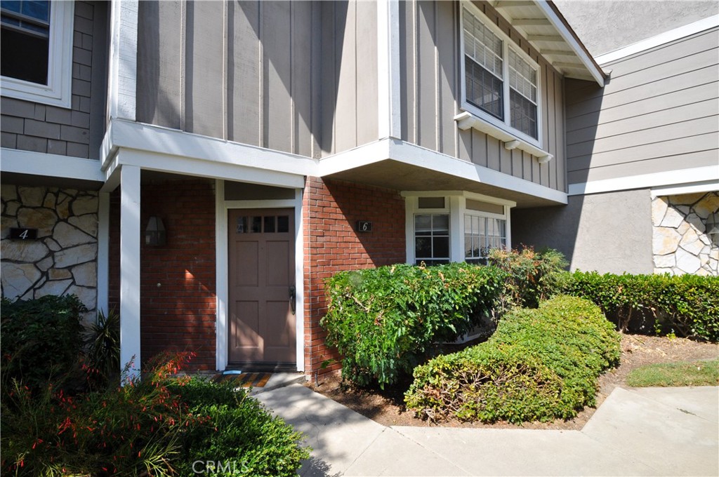 6 Pendelton Irvine, CA 92620 - Photo 1 of 18 a front view of a building with a garden