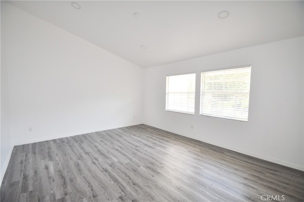 6 Pendelton Irvine, CA 92620 - Photo 16 of 18 an empty room with wooden floor and windows