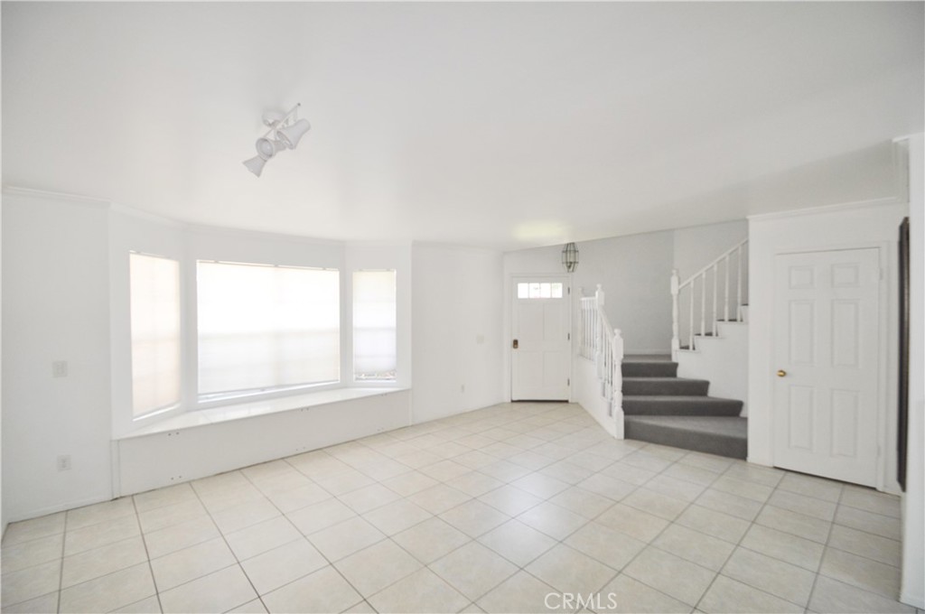 6 Pendelton Irvine, CA 92620 - Photo 3 of 18 an empty room with windows and cabinet