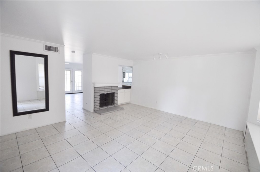 6 Pendelton Irvine, CA 92620 - Photo 5 of 18 an empty room with windows and fireplace