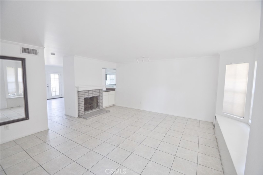 6 Pendelton Irvine, CA 92620 - Photo 6 of 18 an empty room with a fireplace
