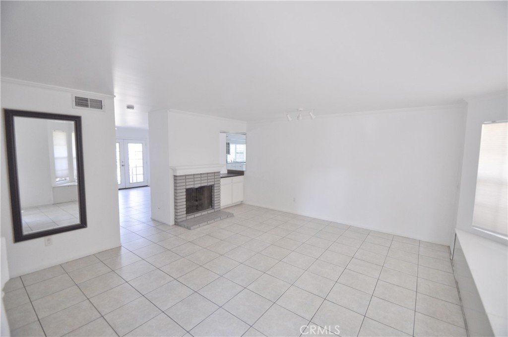 6 Pendelton Irvine, CA 92620 - Photo 7 of 18 an empty room with windows and fireplace