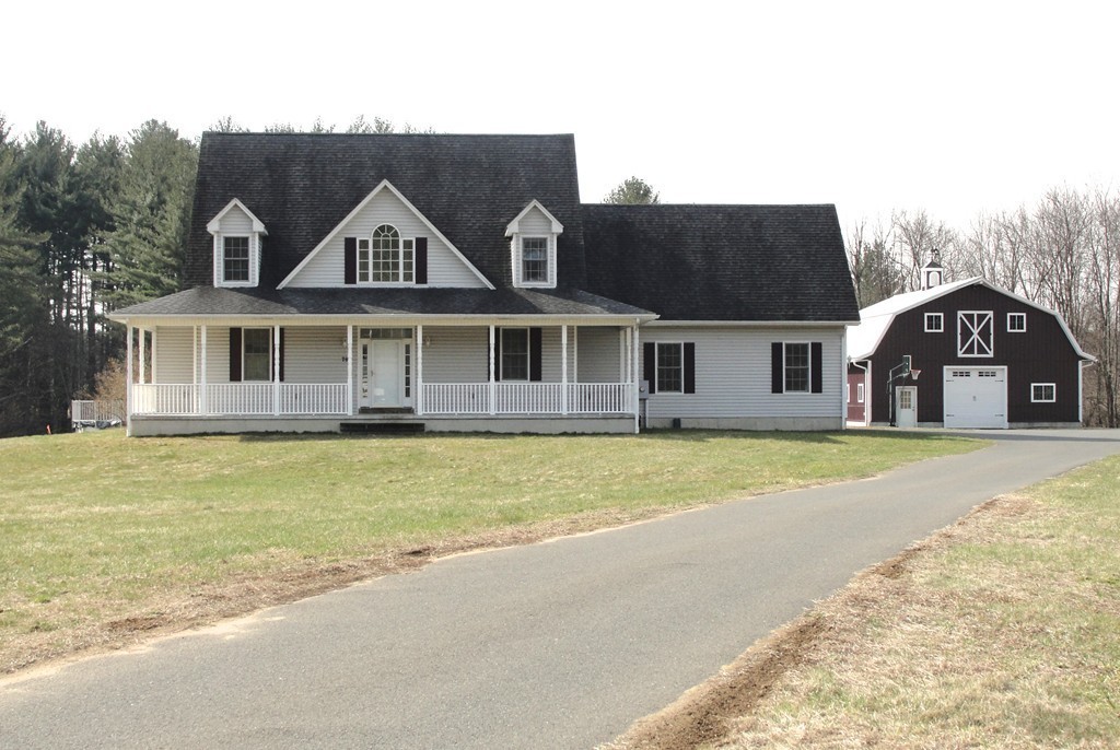 79 Valley Road Southampton, MA 01073 - Photo 1 of 30 a front view of a house with a swimming pool